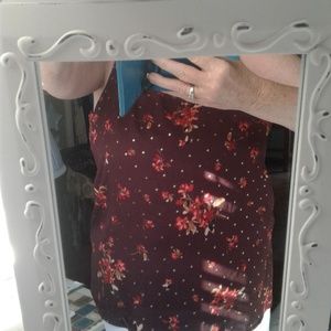 burgundy blouse with floral print/gold accents.